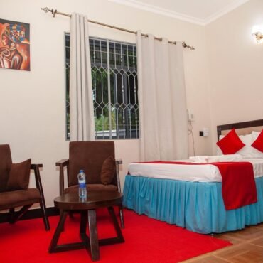 Stay in our cozy deluxe rooms at Family Ties Inn in Bagamoyo, equipped with modern amenities for a comfortable experience.